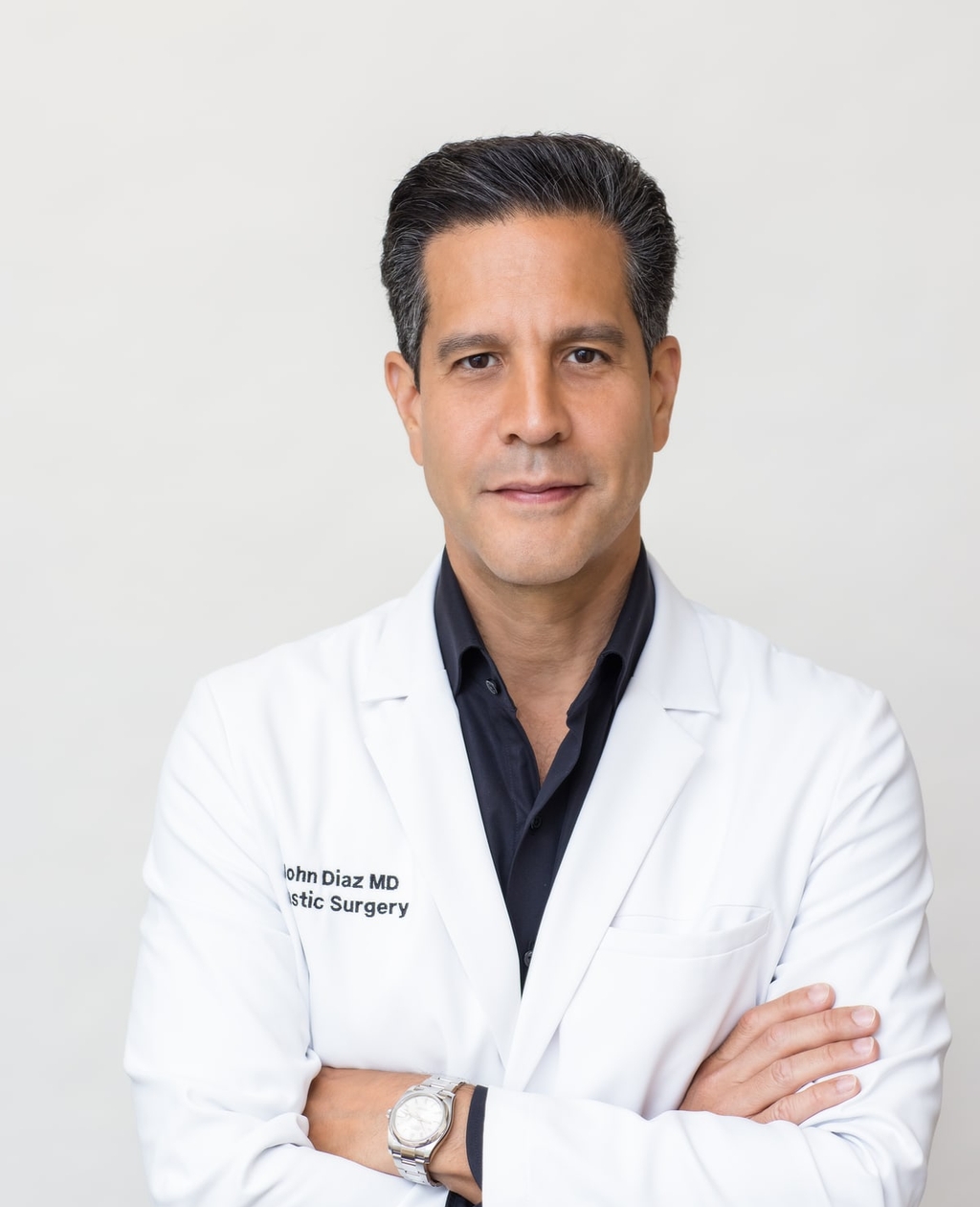 Dr. John Diaz in a white coat